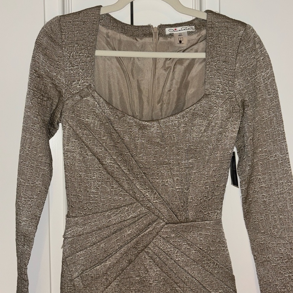 Tan quarter sleeve mid length dress.